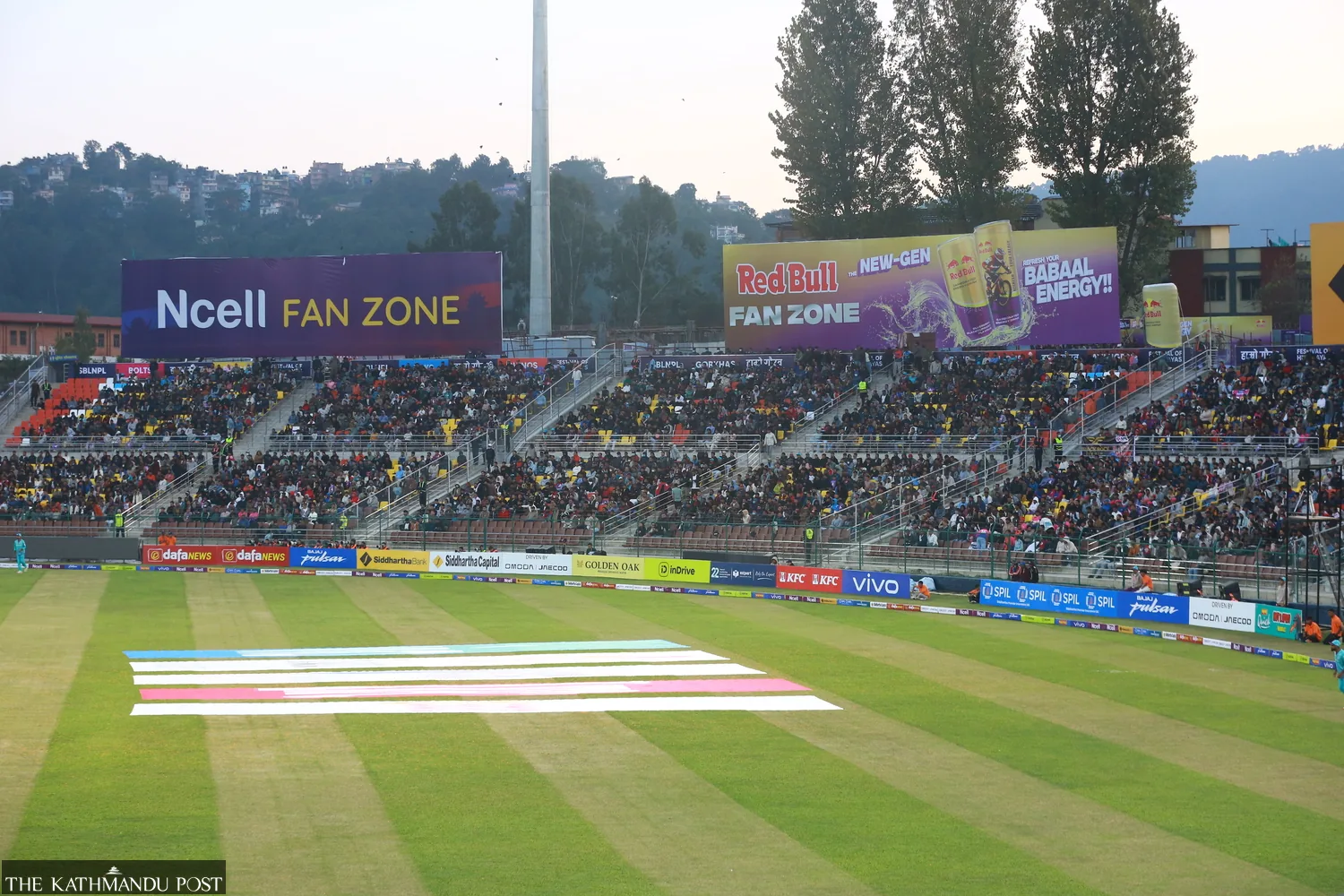 Crowded stands and green outfield at TU Cricket Stadium in Kirtipur during the Nepal Premier League
