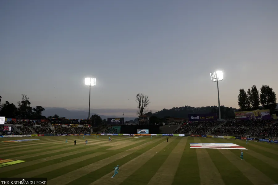 TU Cricket Stadium under floodlights in 2025